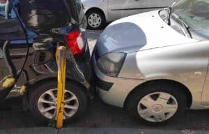 Car backing into another car accident.