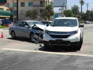 Car accident under traffic signal.