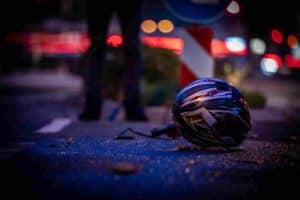 Motorcycle helmet on road after accident.